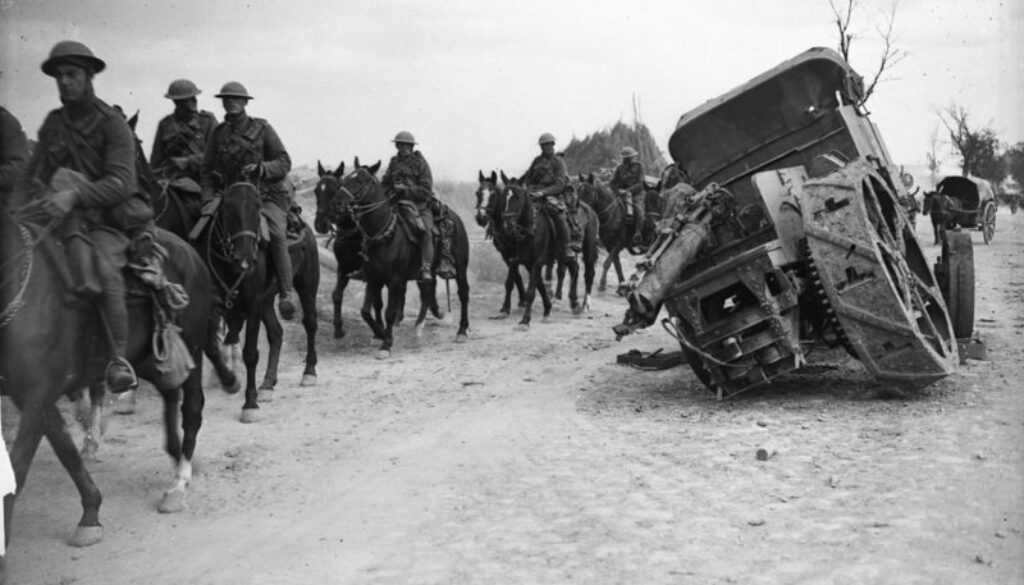 116_Canadian Cavalry passing damaged German tractor. Advance East of Arras. Sept. 1918.